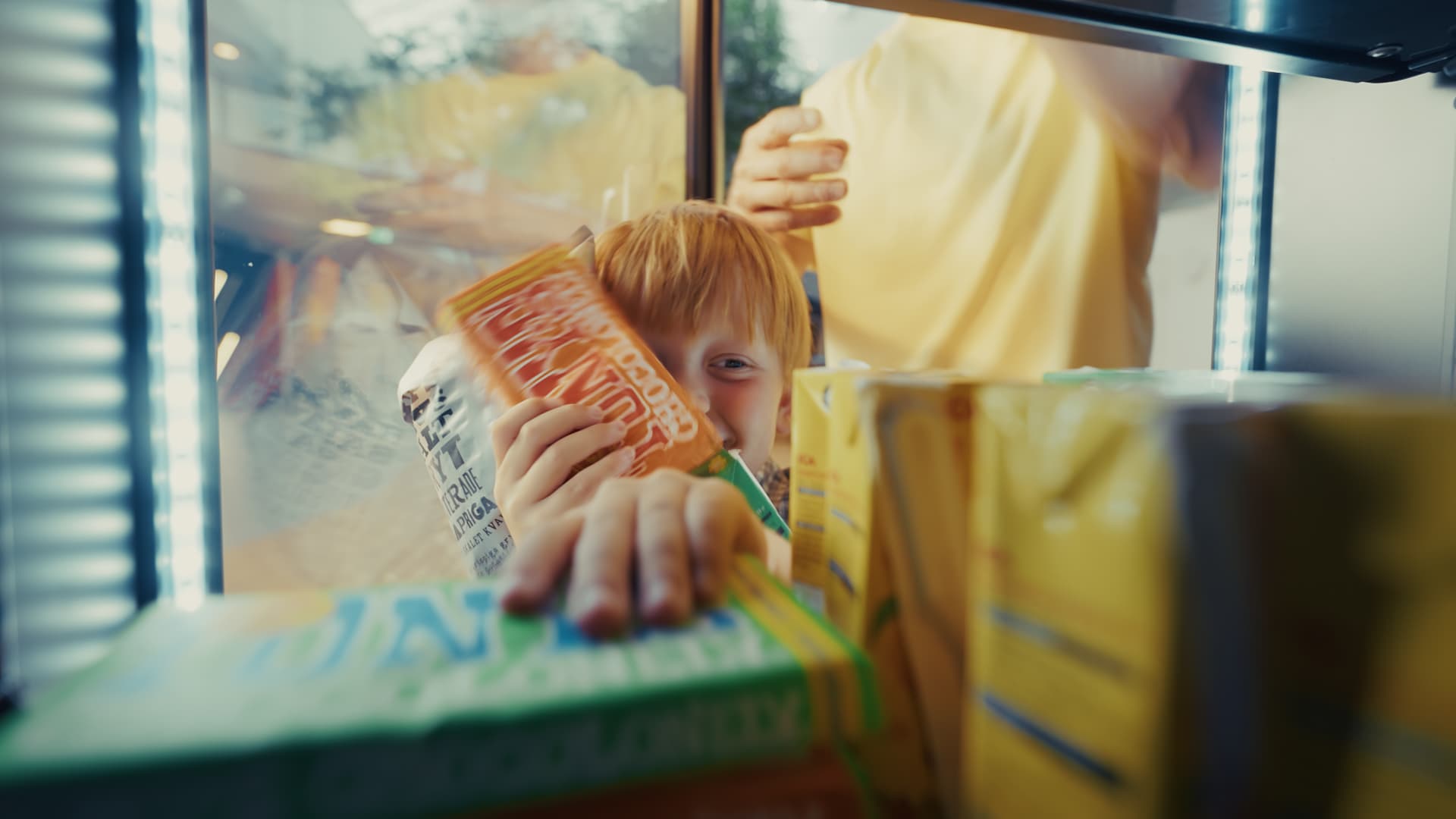 Little kid buying from smart vending machine